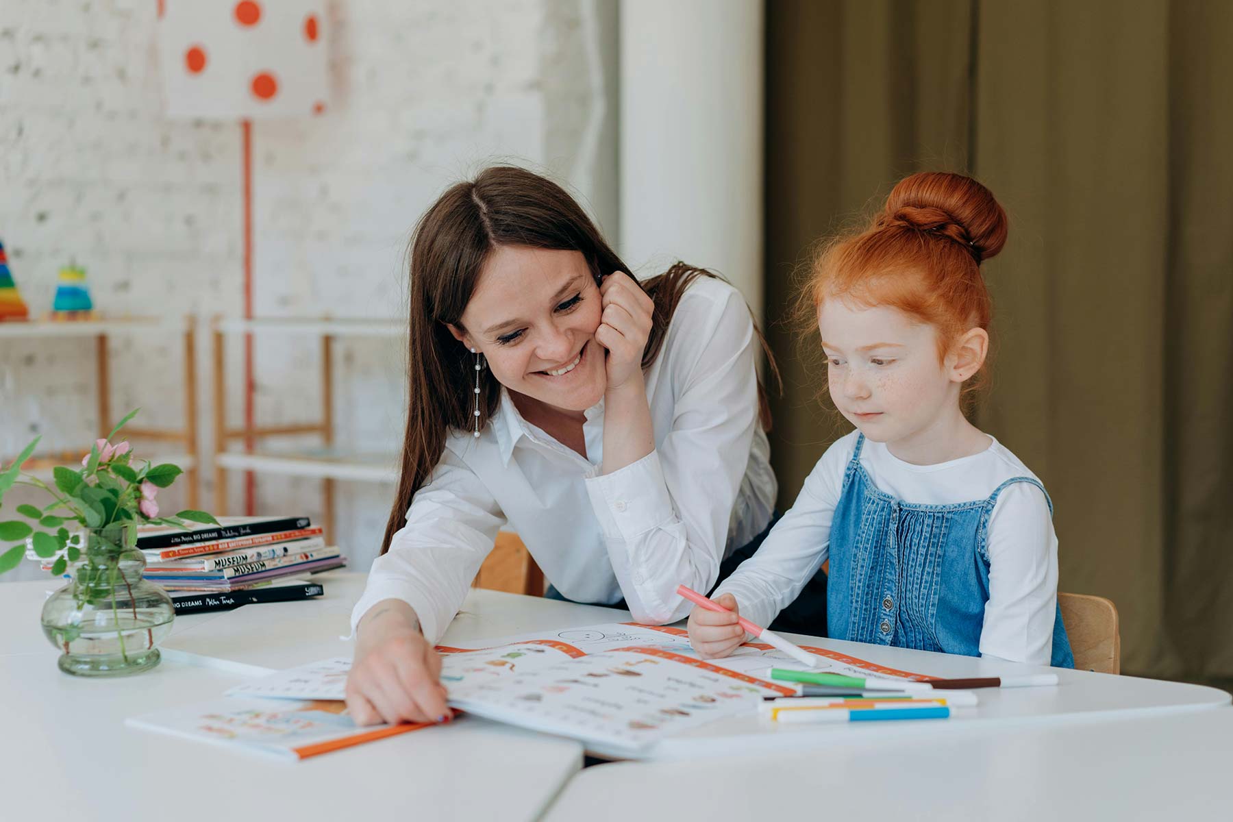 Therapist helping a client read